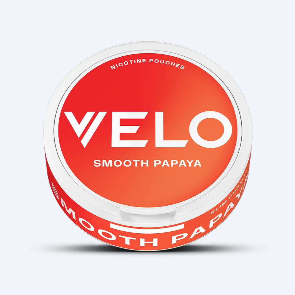 Velo Nicotine Pouches |  A round VELO Smooth Papaya container features a vibrant red and orange gradient label with bold white text and a crisp white lid, perfectly encapsulating the tropical essence found in every nicotine pouch.