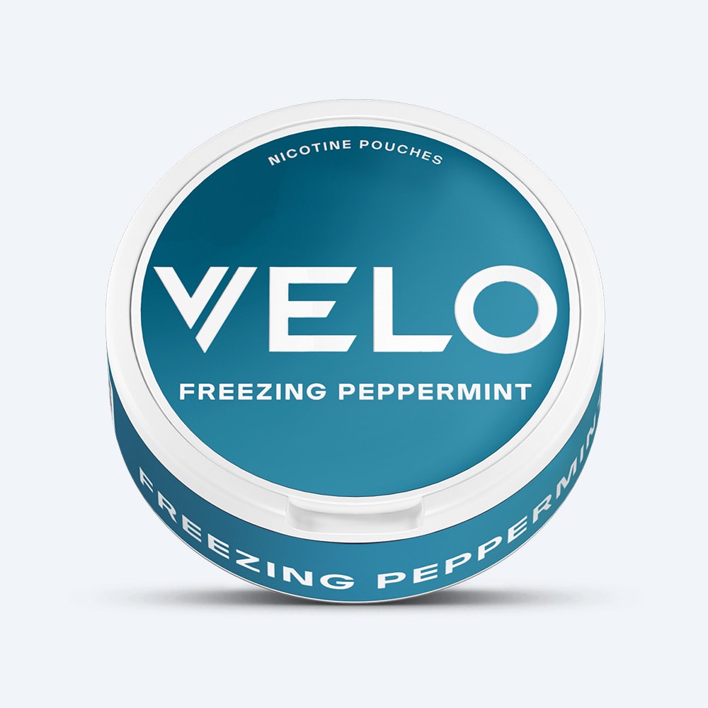 Velo Nicotine Pouches |  A round, teal can labeled VELO Freezing Peppermint, one of the brand's strongest mint nicotine pouches, is set against a light background.