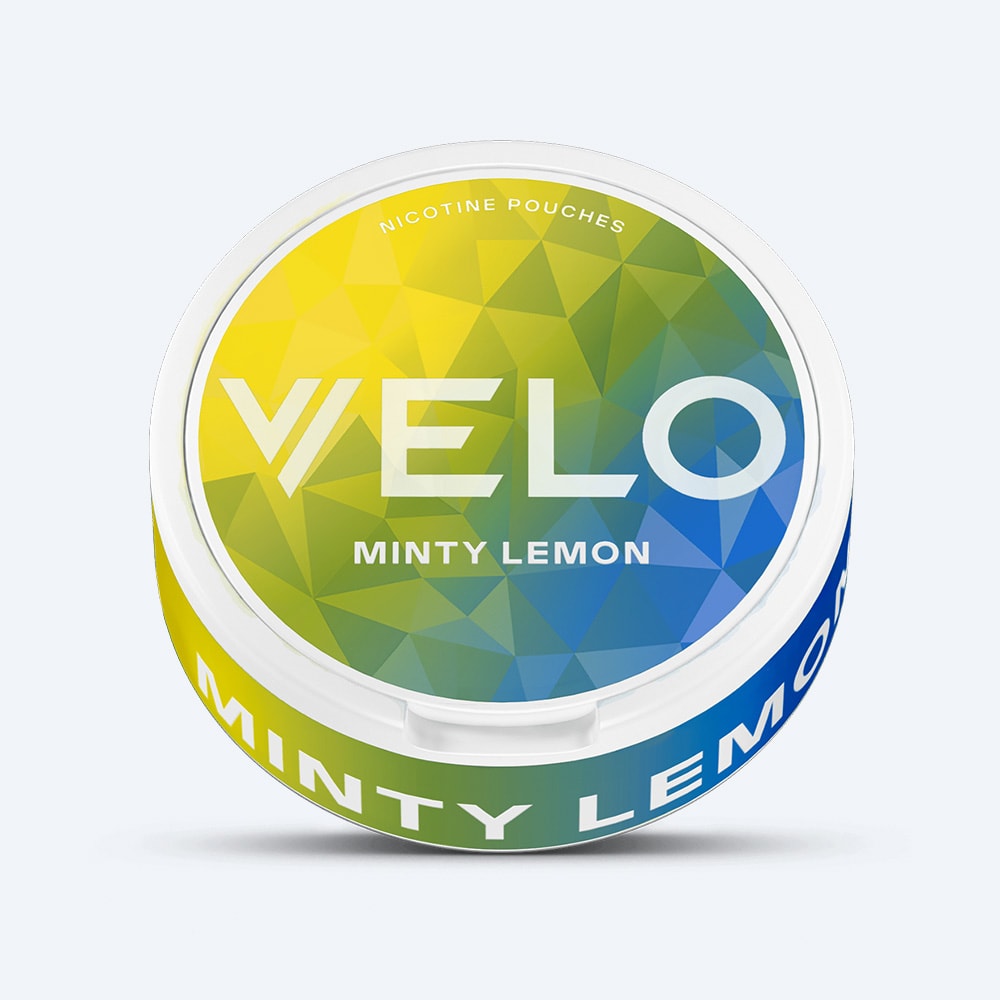 Velo Nicotine Pouches |  A round container labeled VELO Minty Lemon displays a geometric yellow, green, and blue design on the lid and side, complementing the refreshing combination of lemon and peppermint flavors inside.