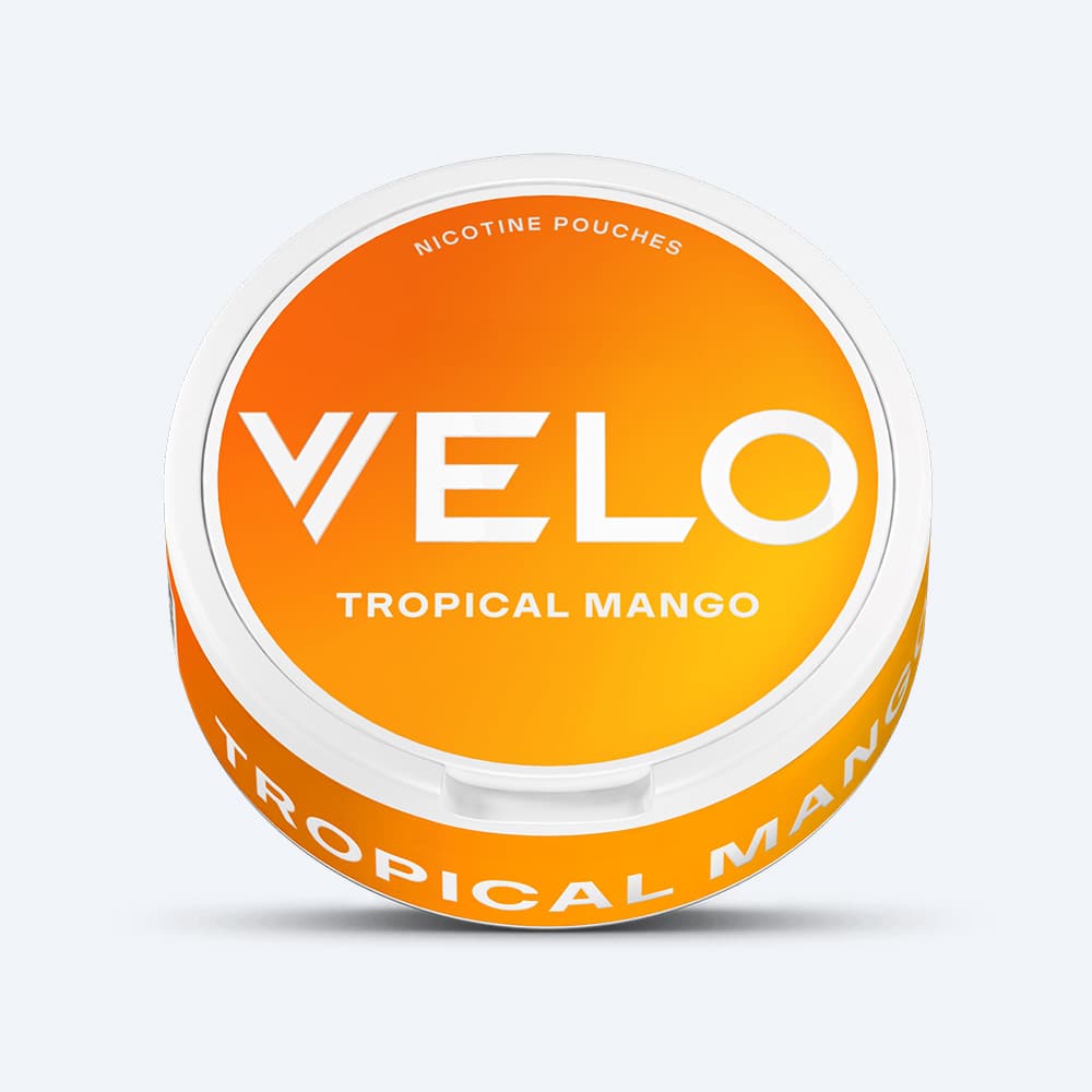 Velo Nicotine Pouches |  A round VELO Tropical Mango container, showcasing exotic fruit flavors with a vibrant orange and yellow gradient lid and bold white lettering.