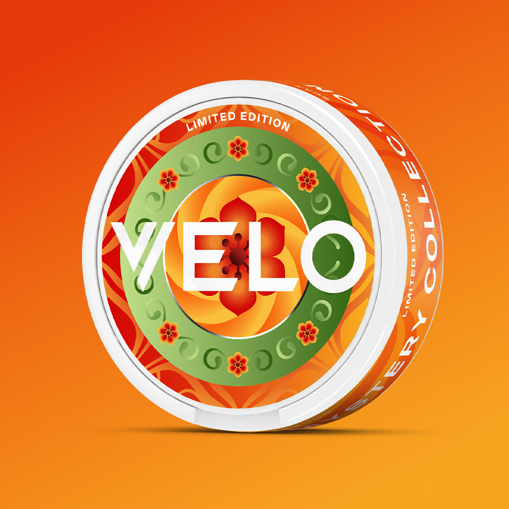 Velo Nicotine Pouches |  Round container of VELO Mystery Collection 1 pouches with a circular label featuring a geometric pattern of red and green swirls, small flowers, and the text LIMITED EDITION and MYSTERY COLLECTION.