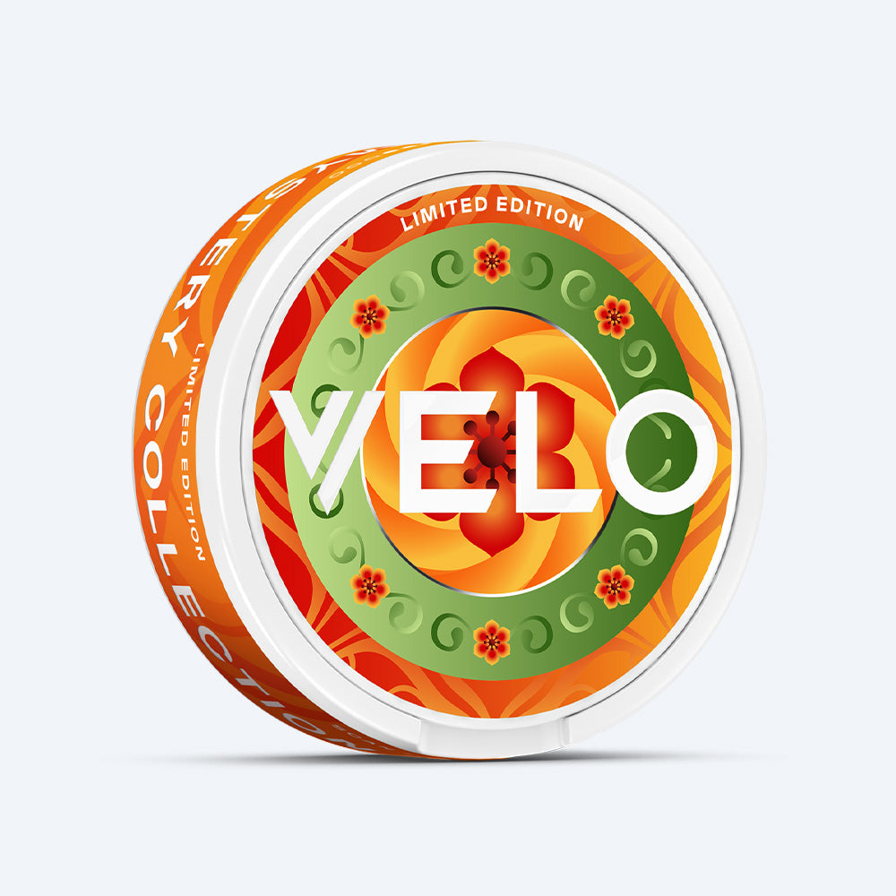 Velo Nicotine Pouches |  A round container of VELO Mystery Collection 1 nicotine pouches featuring a bright orange and green floral pattern, the word VELO in the center, and Limited Edition text around the rim.