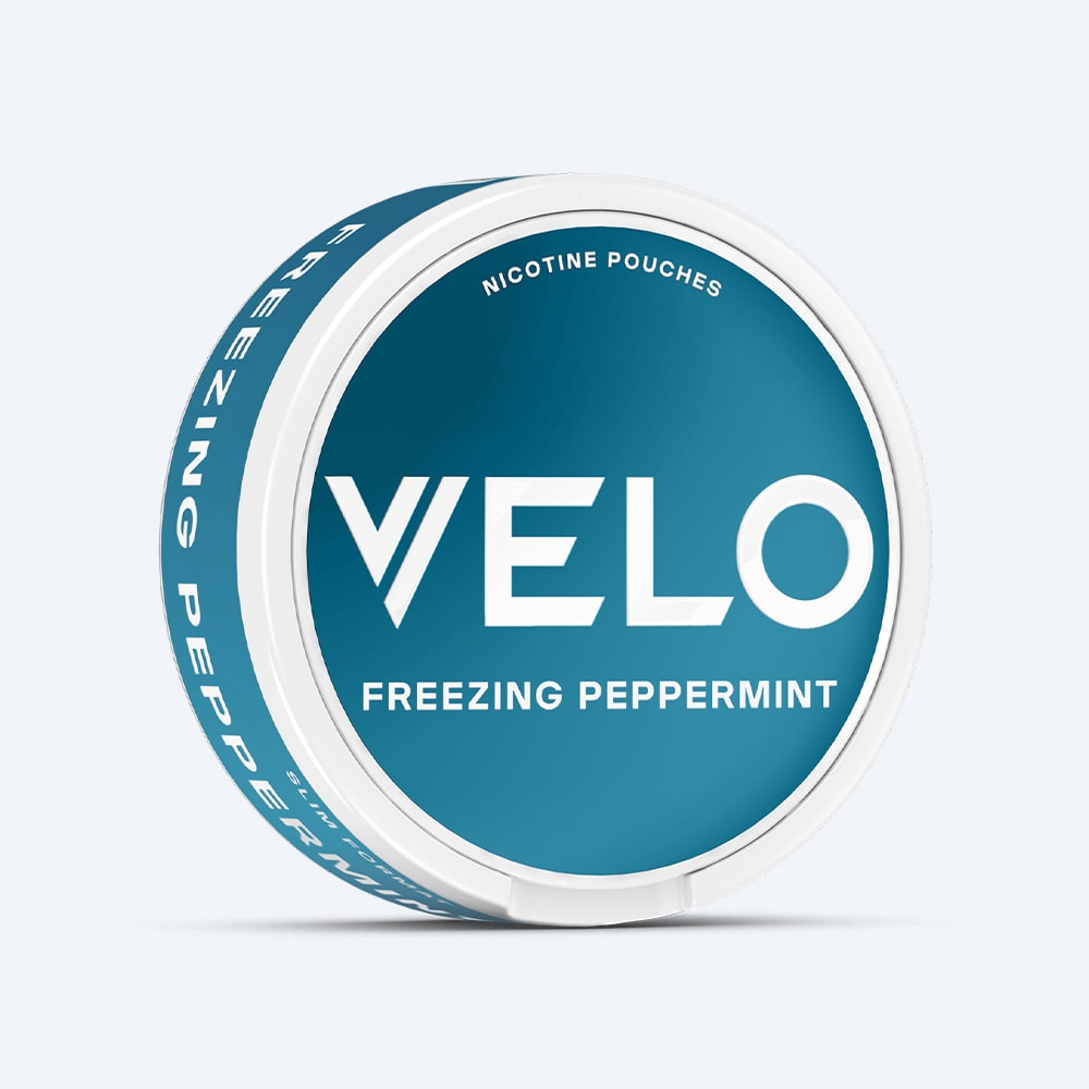 Velo Nicotine Pouches |  A VELO Freezing Peppermint round container, delivering the strongest menthol sensation, with a teal blue lid and white text.