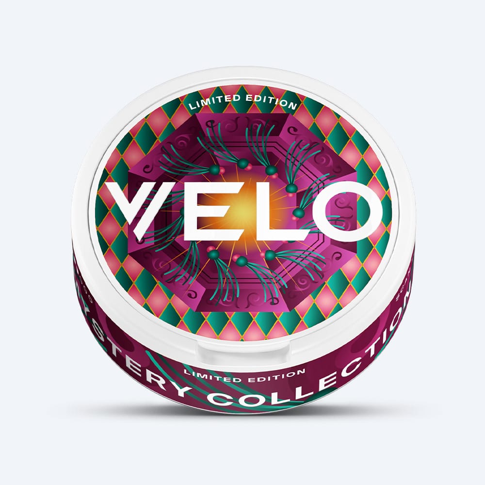 Velo Nicotine Pouches |  Round white container of VELO GB Mystery Collection Bundle nicotine pouches with a geometric patterned lid featuring purple, green, and pink colors, labeled Limited Edition Mystery Collection.