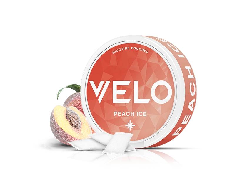 Velo Nicotine Pouches |  Round container of VELO Peach Ice nicotine pouches with a peach illustration and white pouches in front. The orange and white packaging features bold text, highlighting the refreshing Velo nicotine experience.